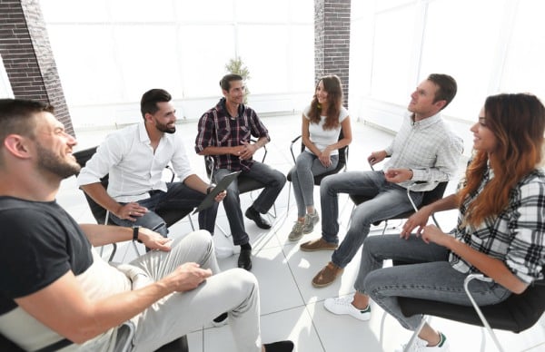 Group-sitting-in-circle-and-laughing